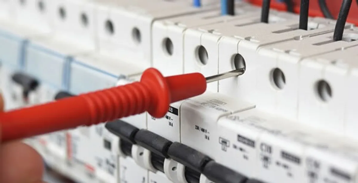 Electrical contractor testing circuit breakers during electrical repair in Kathleen, FL