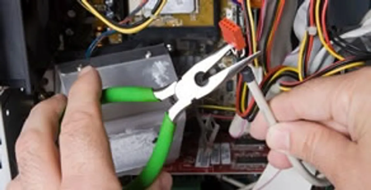 Licensed electrical contractor performing electrical repair with tools in Bartow, FL