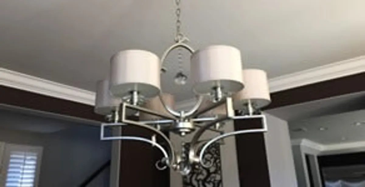 Modern chandelier installation with multiple light fixtures in Lakeland, FL